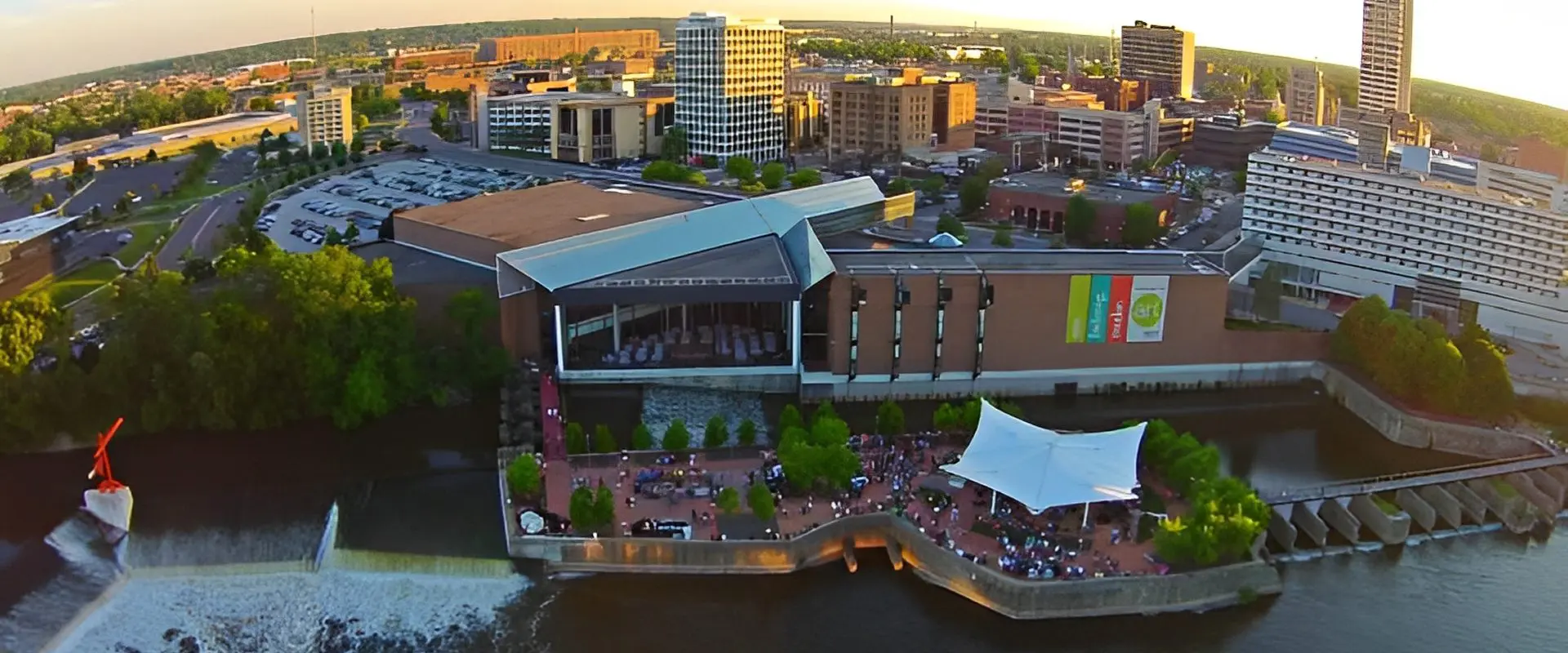 Aerial view of cityscape and riverfront area.